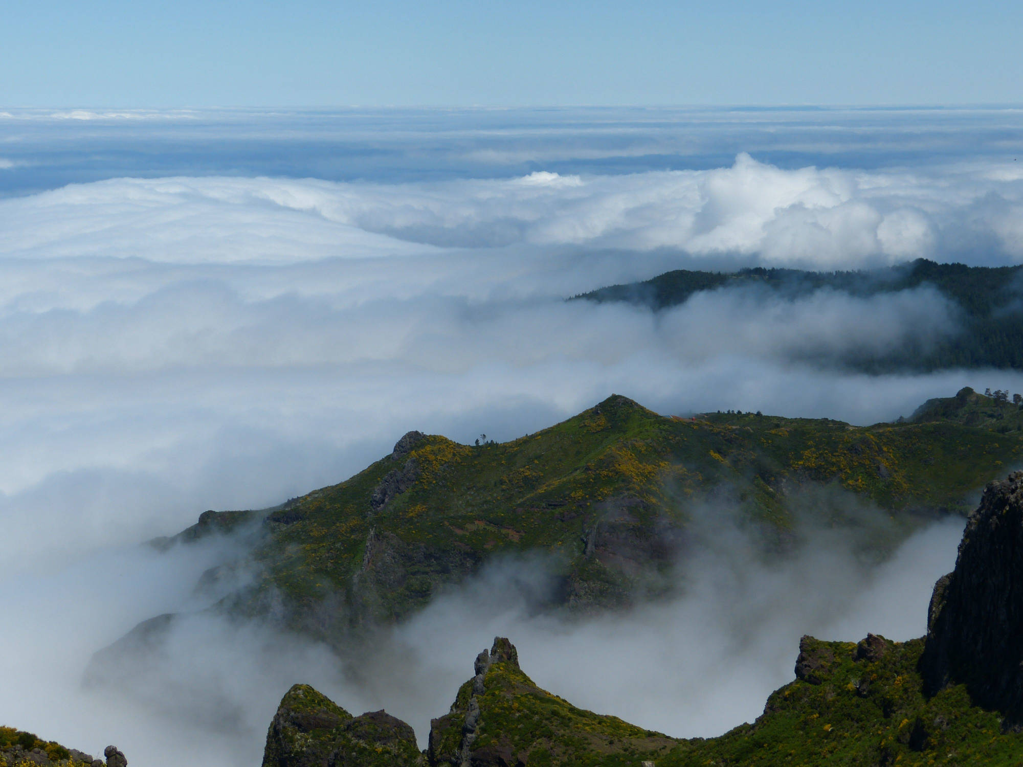 View from a mountain top on a mountain range covered in a sea of
clouds